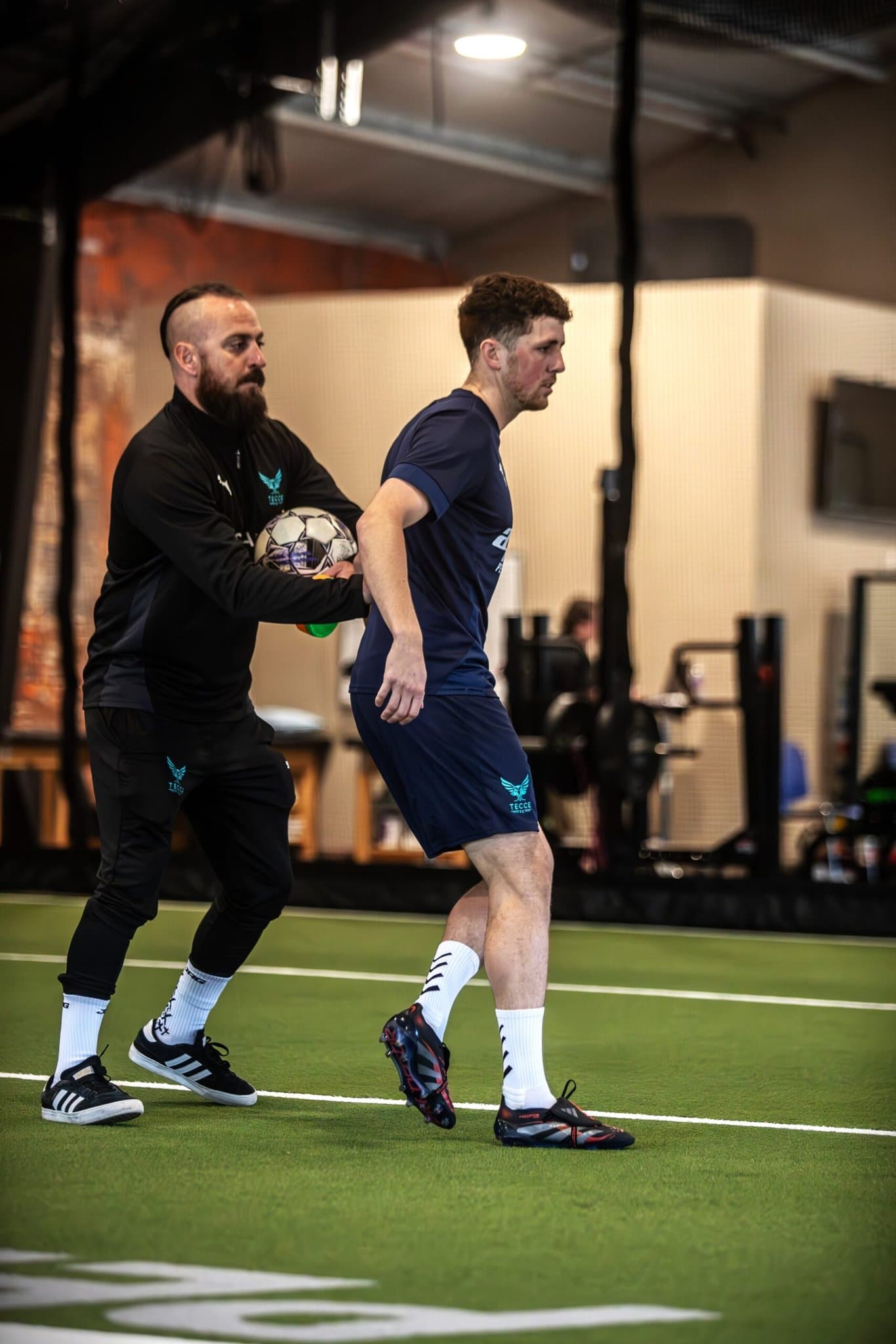 Football players competing on the pitch